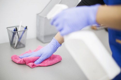 Professional carpet cleaning team reviewing health and safety procedures